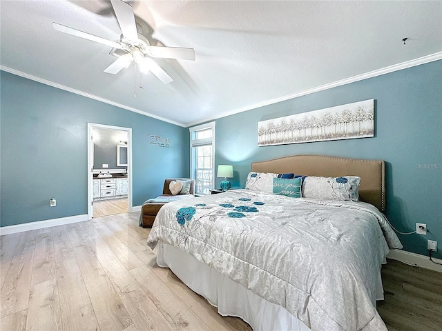 bedroom featuring light wood finished floors, baseboards, a ceiling fan, connected bathroom, and crown molding