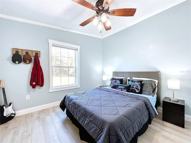 bedroom with crown molding, ceiling fan, and light hardwood / wood-style flooring