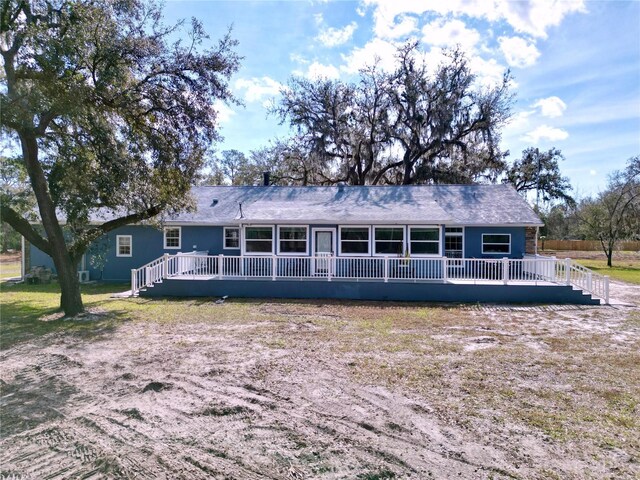 view of front of property with a wooden deck