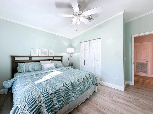 bedroom with baseboards, visible vents, and light wood-style floors