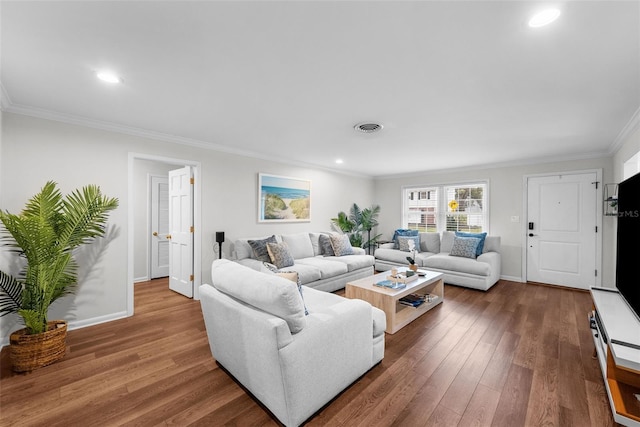 living room with hardwood / wood-style floors and ornamental molding