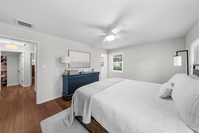 bedroom with dark wood-type flooring and ceiling fan