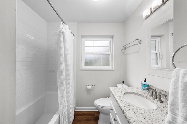 full bathroom featuring vanity, hardwood / wood-style flooring, toilet, and shower / bath combo with shower curtain