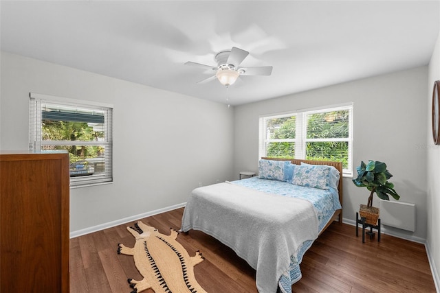 bedroom featuring dark hardwood / wood-style floors and ceiling fan