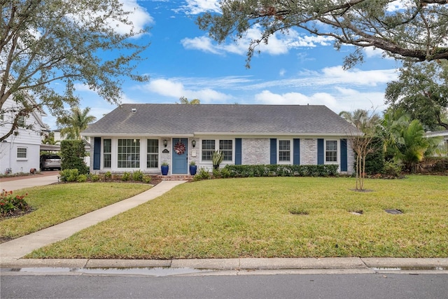 single story home with a front lawn