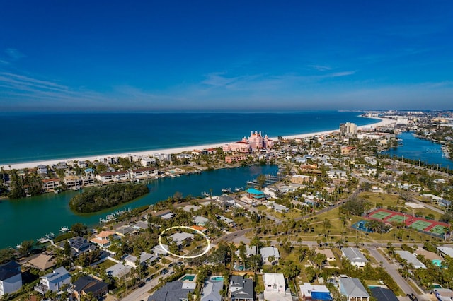 birds eye view of property with a water view and a view of the beach