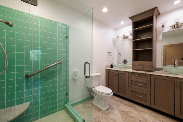 bathroom featuring tile patterned flooring, vanity, toilet, and walk in shower