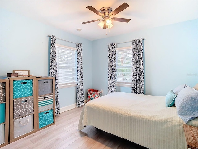 bedroom featuring ceiling fan and light hardwood / wood-style floors