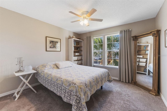 carpeted bedroom with a textured ceiling and ceiling fan