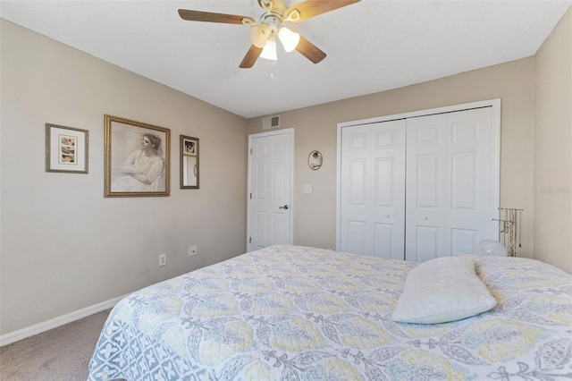 carpeted bedroom featuring a closet and ceiling fan