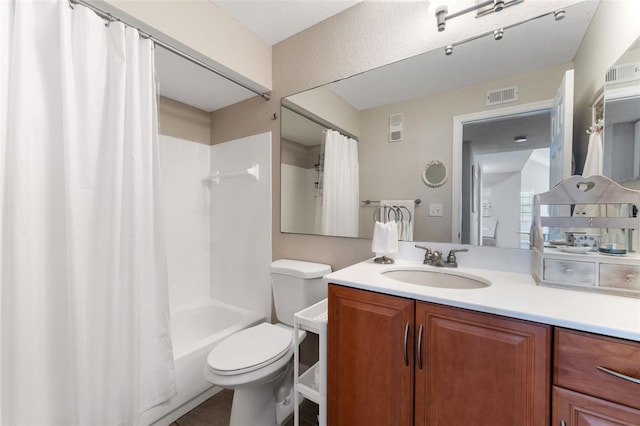 full bathroom featuring shower / bathtub combination with curtain, vanity, and toilet