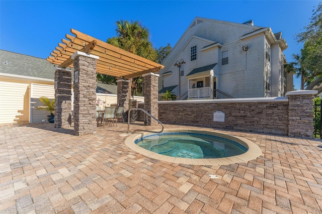 view of swimming pool featuring an in ground hot tub, a pergola, and a patio