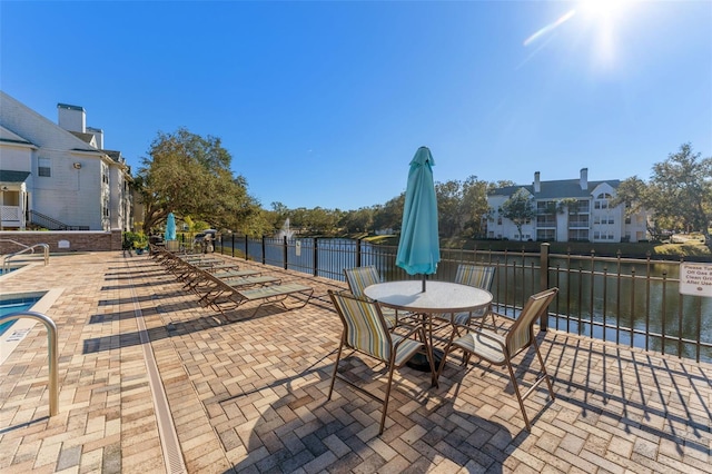 view of patio / terrace with a water view