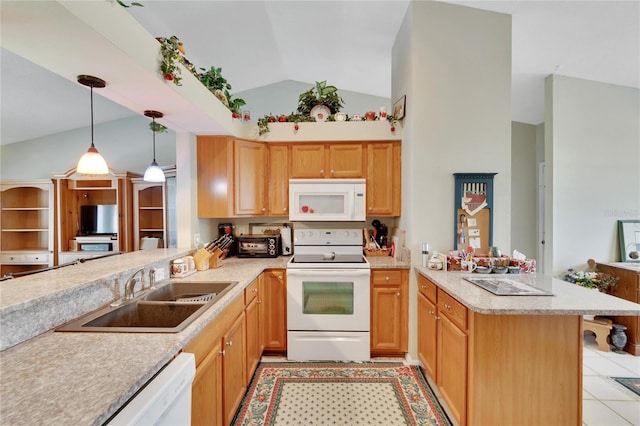 kitchen featuring sink, vaulted ceiling, kitchen peninsula, pendant lighting, and white appliances