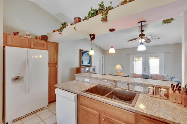 kitchen featuring light tile patterned flooring, lofted ceiling, sink, white appliances, and french doors