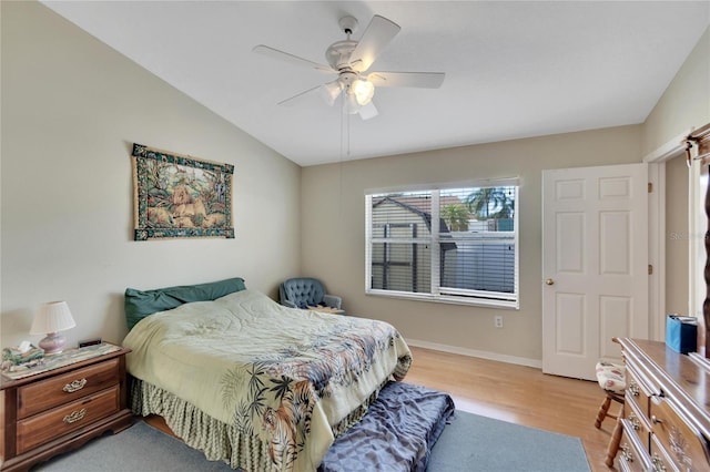 bedroom with lofted ceiling, ceiling fan, and light hardwood / wood-style floors