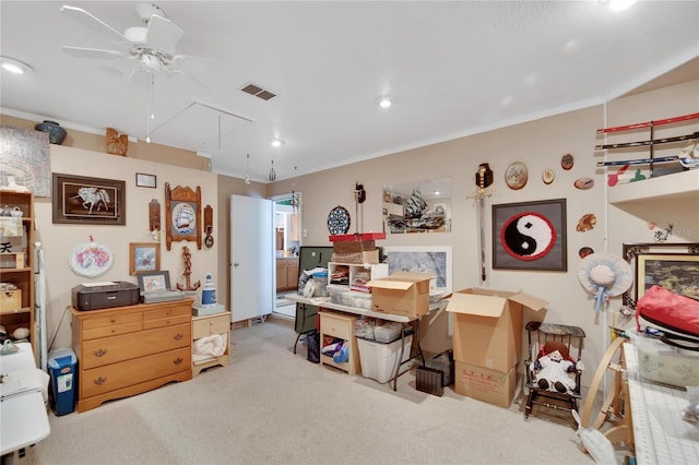 misc room with ceiling fan, light colored carpet, and ornamental molding