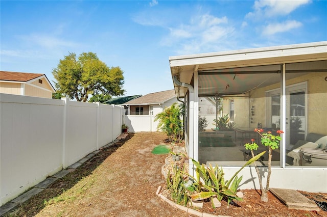 view of yard featuring a sunroom