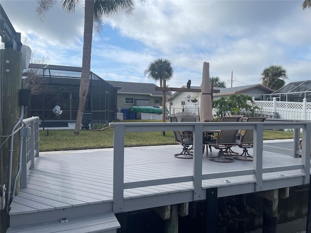 deck featuring a yard and a lanai