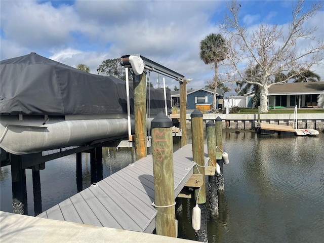 dock area with a water view