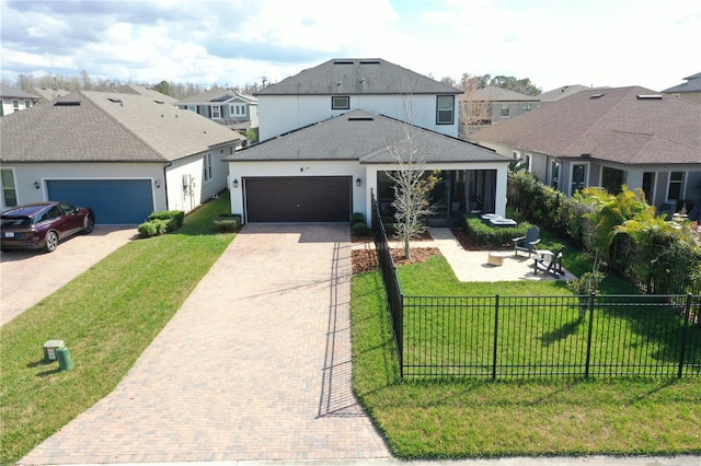 view of front of home with a garage and a front yard