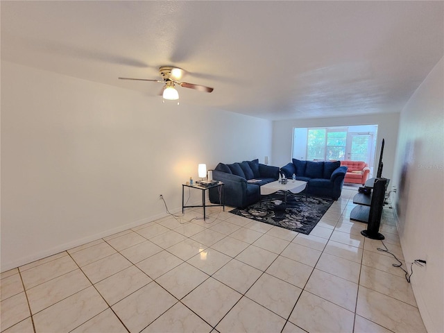 tiled living room with ceiling fan