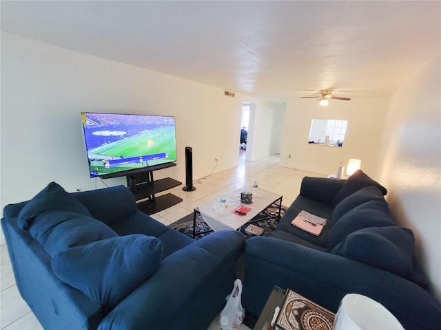 living room featuring light tile patterned flooring and ceiling fan