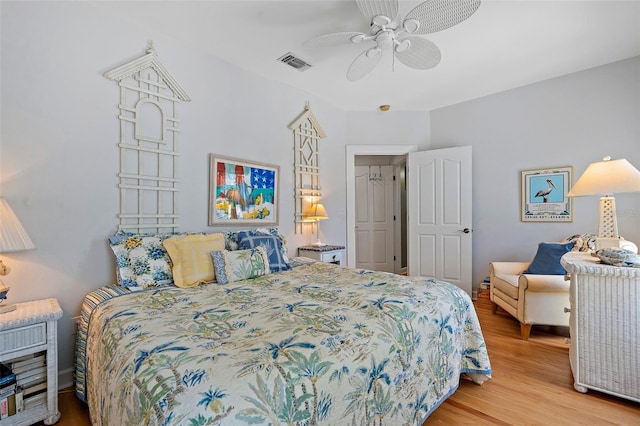 bedroom with ceiling fan and light wood-type flooring