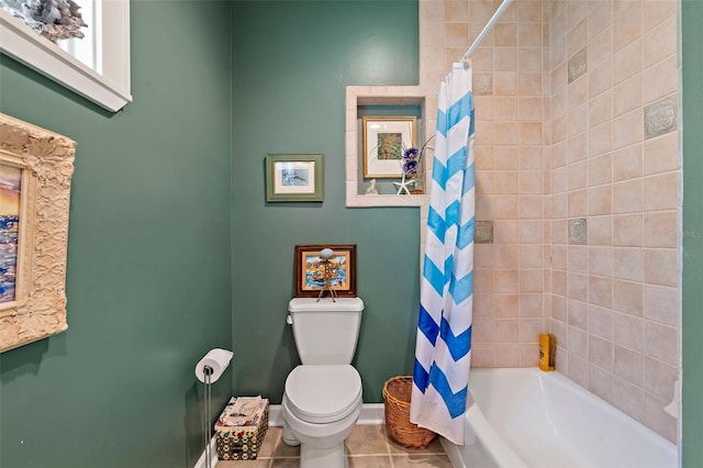 bathroom with tile patterned floors, shower / bath combination with curtain, and toilet