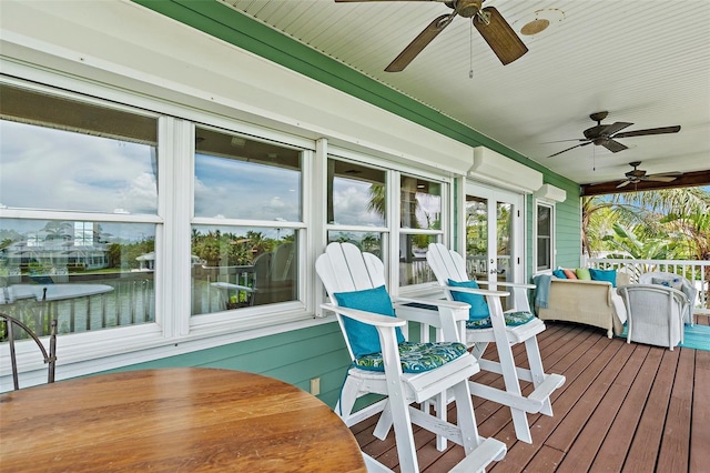 deck featuring french doors and ceiling fan