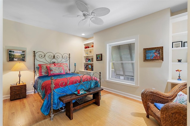 bedroom with ceiling fan and wood-type flooring