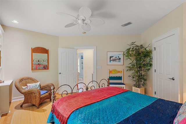 bedroom featuring hardwood / wood-style floors and ceiling fan