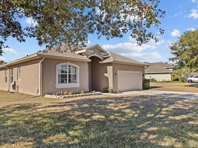 view of front facade featuring a garage and a front lawn