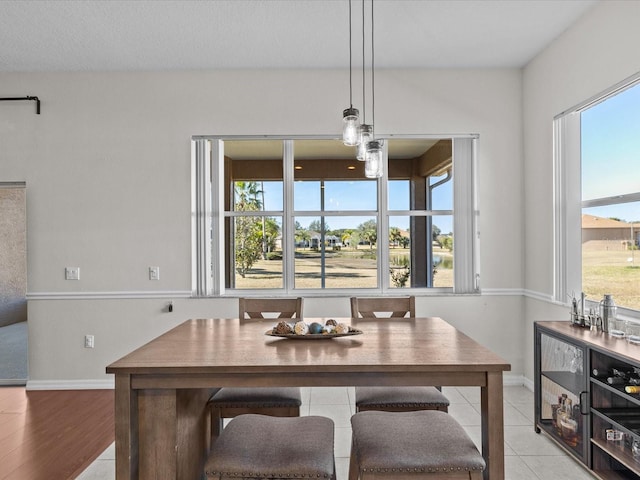 tiled dining area featuring breakfast area