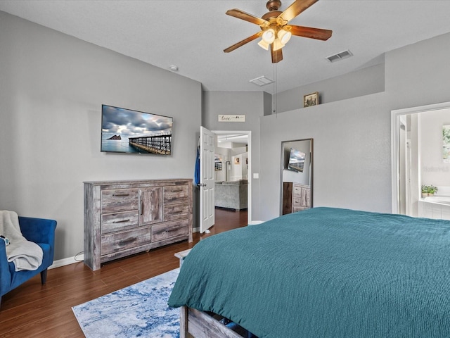 bedroom with dark hardwood / wood-style floors and ceiling fan