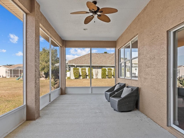 sunroom / solarium with ceiling fan