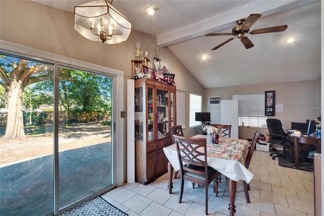 tiled dining area with a textured ceiling, lofted ceiling with beams, and ceiling fan