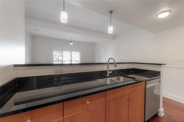 kitchen with decorative light fixtures, dishwasher, sink, dark hardwood / wood-style flooring, and ceiling fan