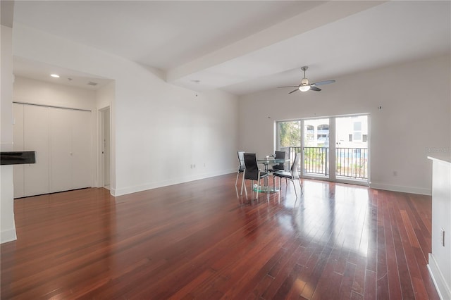 unfurnished living room with dark hardwood / wood-style floors and ceiling fan