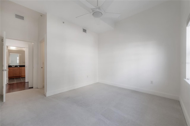 carpeted empty room with ceiling fan