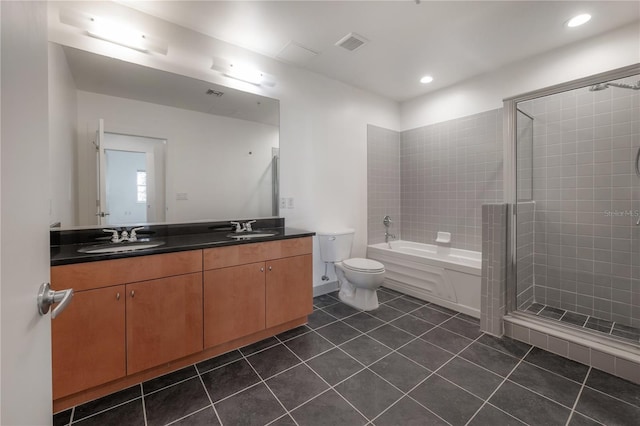 bathroom featuring tile patterned flooring, vanity, and toilet