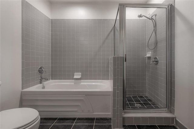 bathroom with toilet, independent shower and bath, and tile patterned flooring