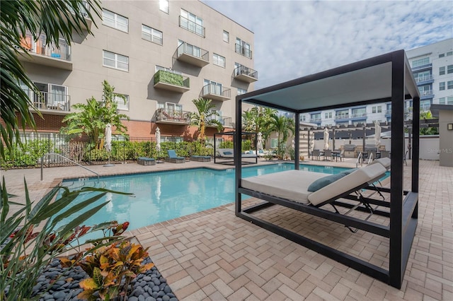 view of swimming pool featuring a patio