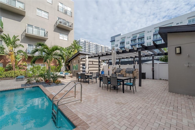 view of pool with a pergola and a patio area