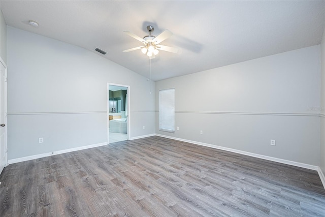 unfurnished room featuring vaulted ceiling, hardwood / wood-style floors, and ceiling fan