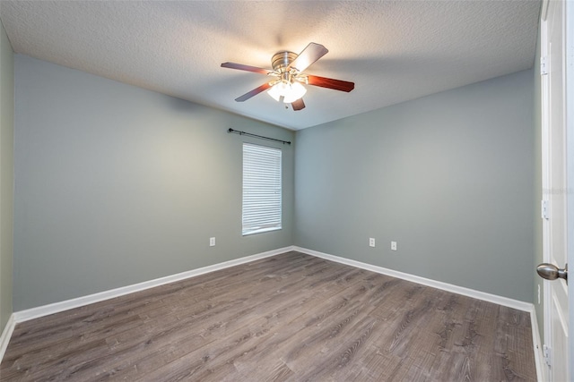 unfurnished room with ceiling fan, wood-type flooring, and a textured ceiling