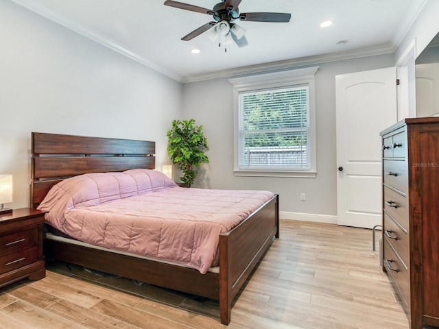 bedroom featuring crown molding, ceiling fan, and light hardwood / wood-style flooring