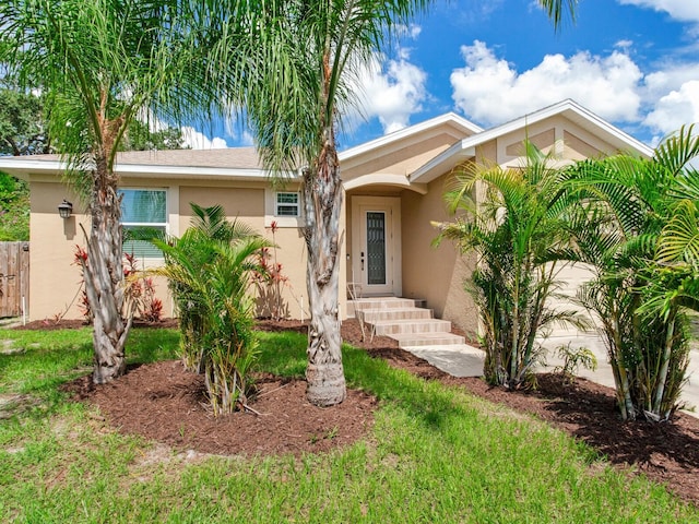 single story home with a front yard