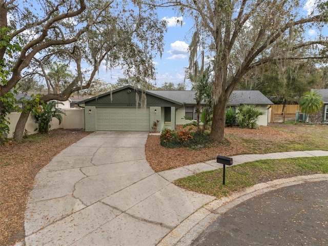 ranch-style house featuring a garage