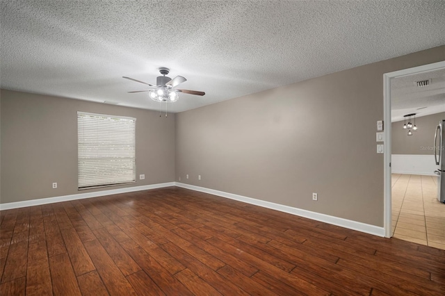 empty room with wood-type flooring, a textured ceiling, and ceiling fan